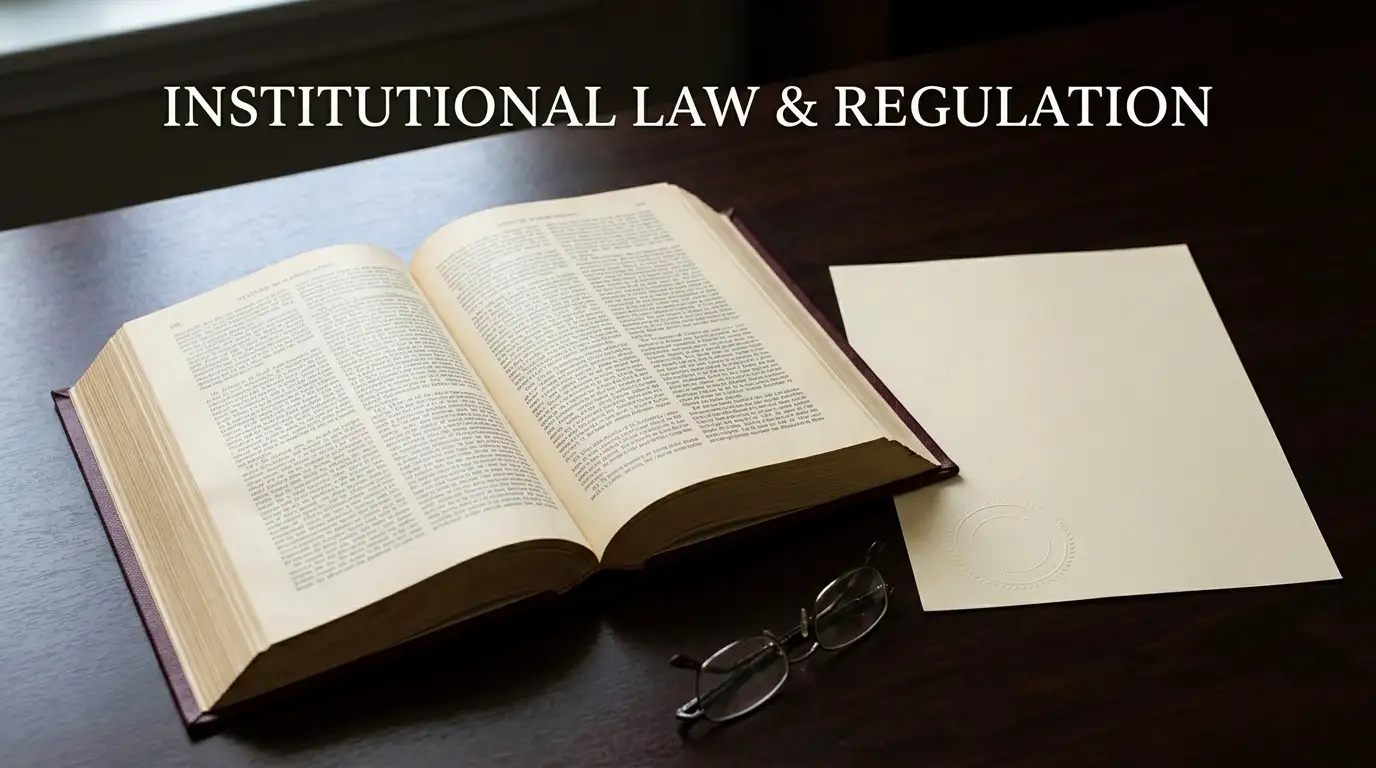 Open statute volume beside a plain licence document on an office desk